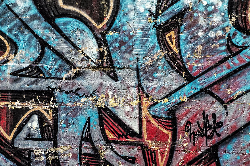 Abstract Blue And Red Graffiti Texture On Weathered Concrete Wall