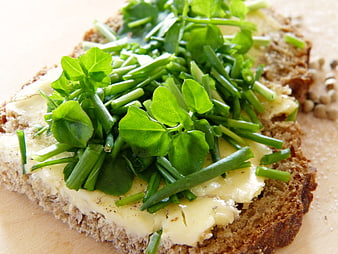 Fresh watercress and chives on buttered rustic bread