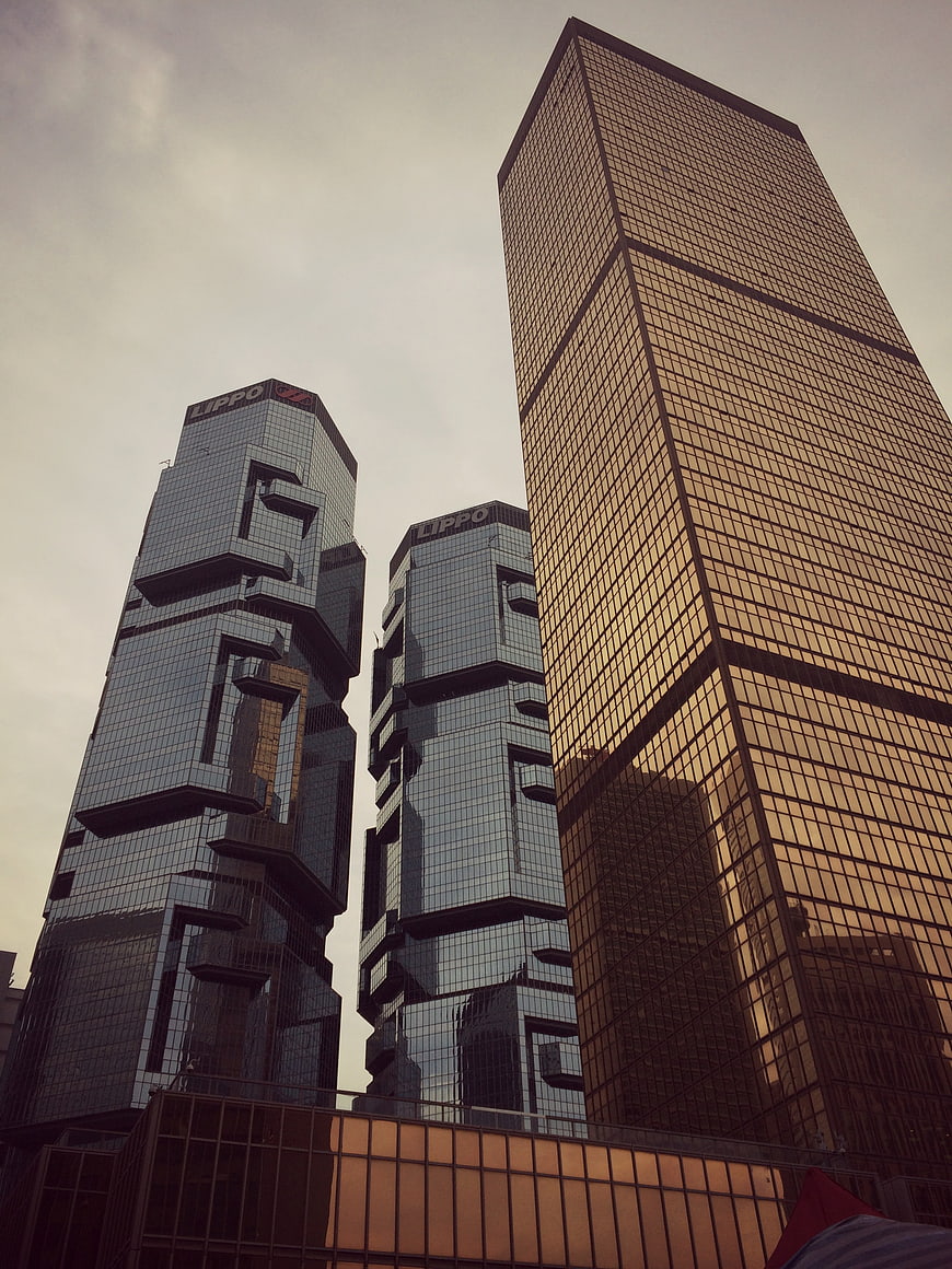 Low angle view of Lippo Centre and Bank of China Tower in Hong Kong