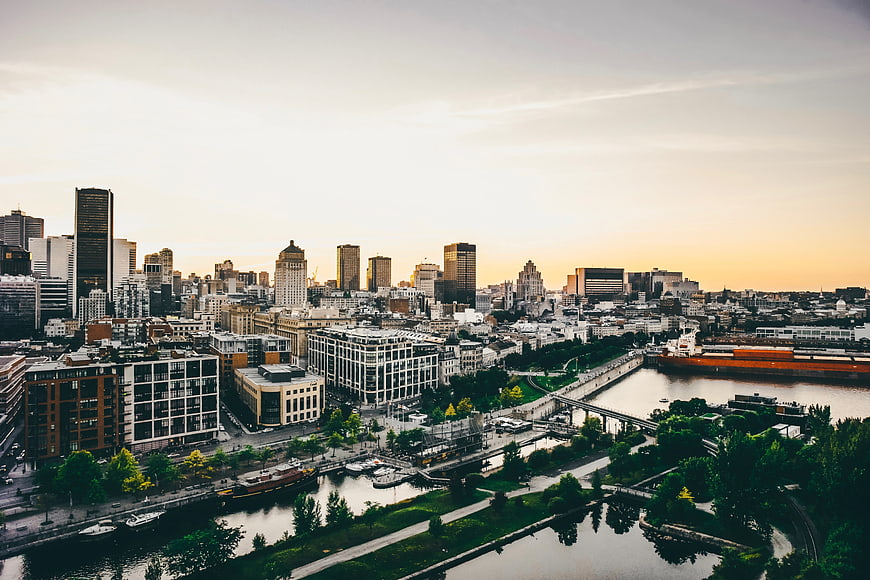 Aerial View of Montreal Skyline at Sunset Over Canal