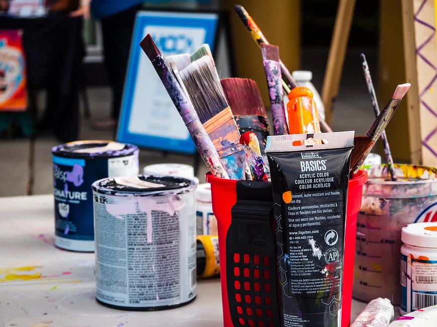 Acrylic Paint Supplies and Brushes on Art Table