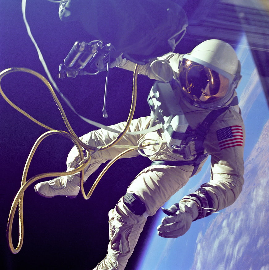 Astronaut performing spacewalk with Earth in background