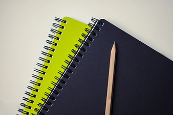 Minimalist Black Notebook and Pencil on Lime Green Pad