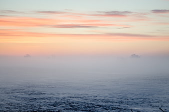Serene Misty Landscape at Dawn with Pink Sky