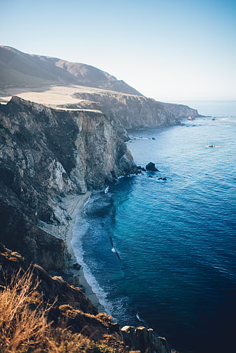Dramatic Coastal Cliffs Meeting Deep Blue Ocean Waters