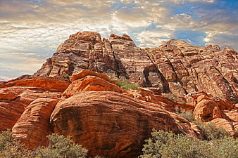 Dramatic Red Rock Canyon Landscape with Cloudy Sky