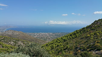 Panoramic View of Coastal City and Sea from Mountain