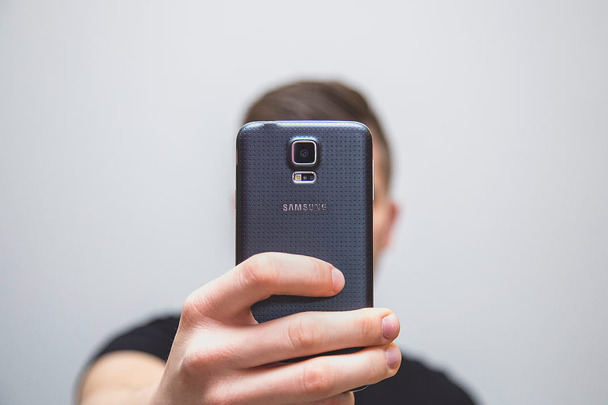 Person Taking Selfie With Black Samsung Smartphone