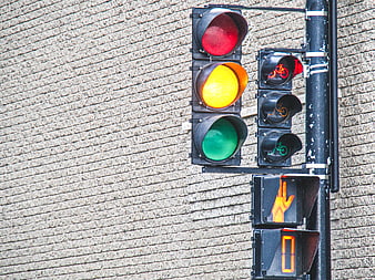 Urban Traffic Light Signal with Brick Wall Background