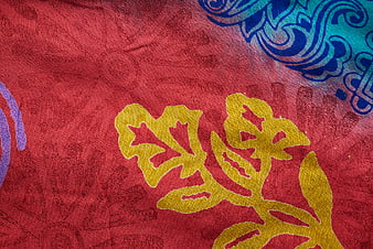 Vibrant Red Textile with Yellow and Blue Floral Patterns