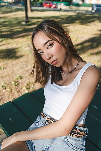 Young Asian Woman Portrait Sitting on Park Bench