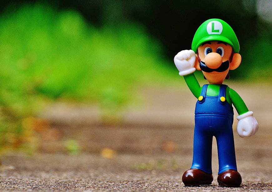 Luigi Action Figure on Outdoor Path