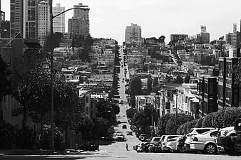 Black and white San Francisco street view with steep hill