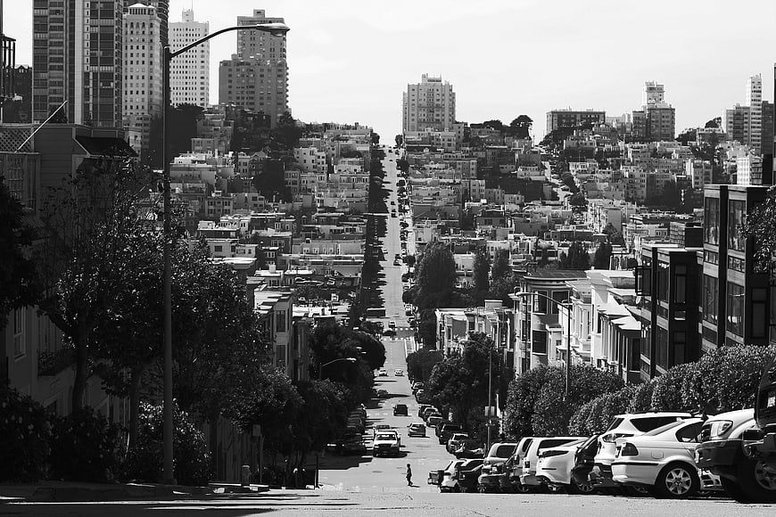 Black and white San Francisco street view with steep hill
