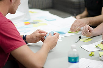 Team brainstorming with sticky notes on table