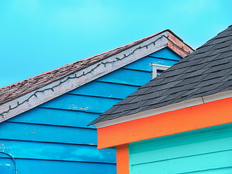 Colorful House Roof Peak with Blue Sky Background