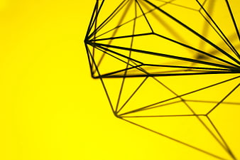Geometric wireframe shadow on bright yellow background