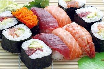 Assorted fresh sushi platter on bamboo mat