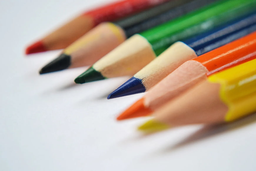 Colorful Pencils Arranged Diagonally on White Background