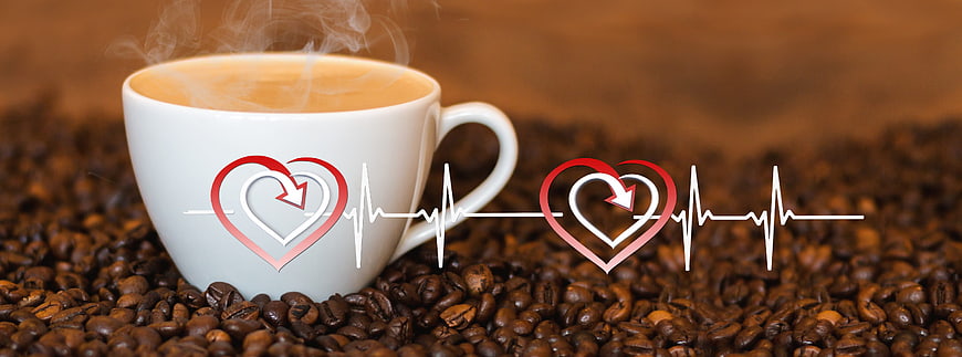 Steaming Coffee Cup on Beans with Heartbeat Graphic