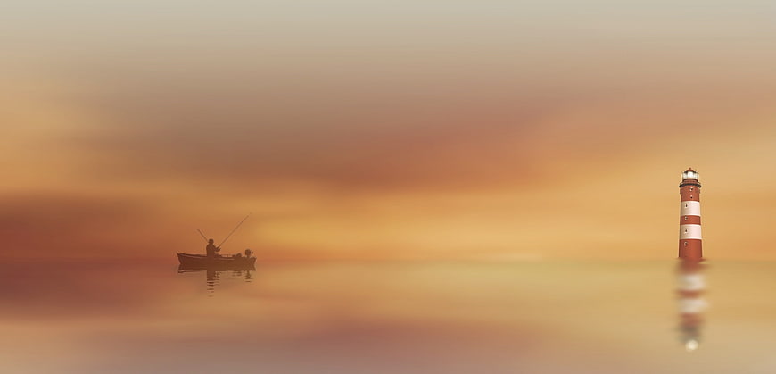 Silhouette of fisherman in boat near lighthouse at sunset