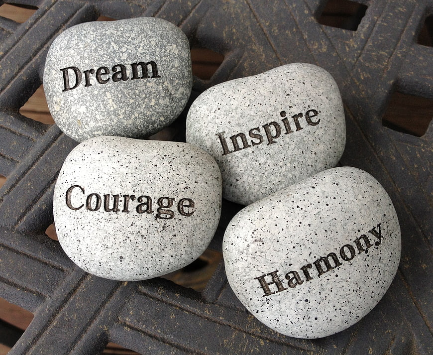 Inspirational stones with words dream, inspire, courage, harmony