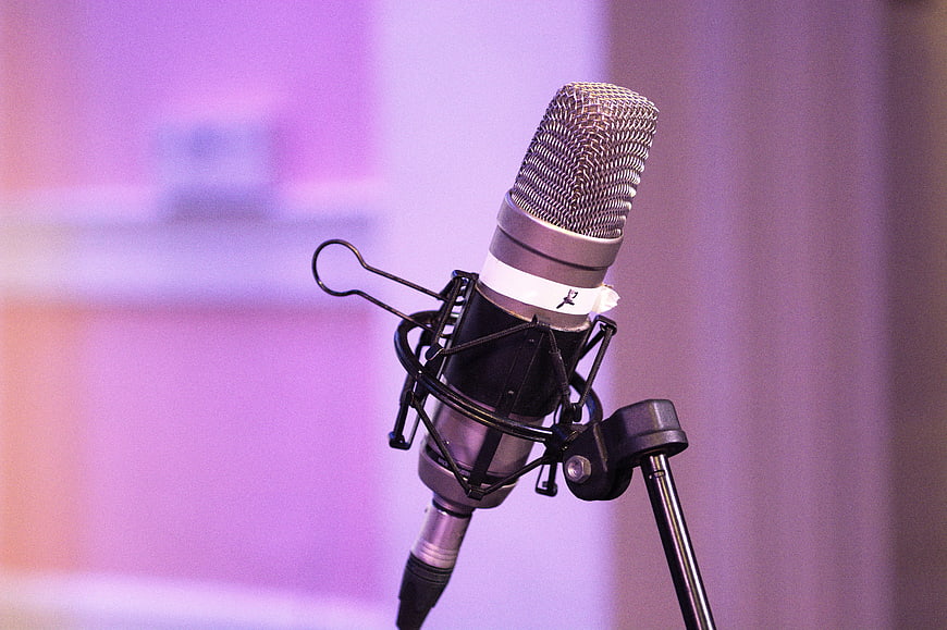 Professional Studio Microphone Close-Up With Soft Purple Background