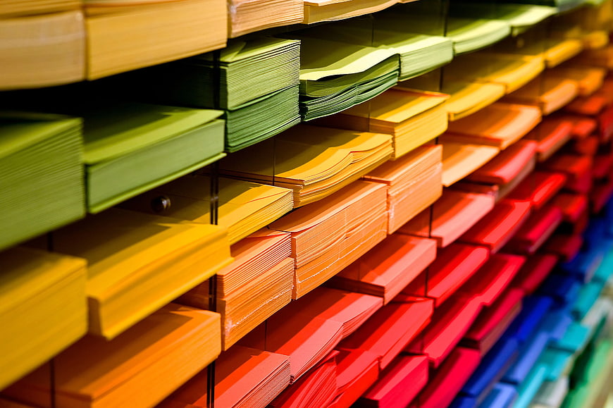 Colorful Paper Folders Organized on Office Shelves