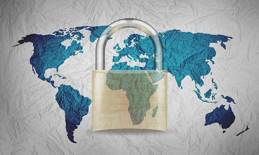 World Map with Padlock on Crumpled Paper Background