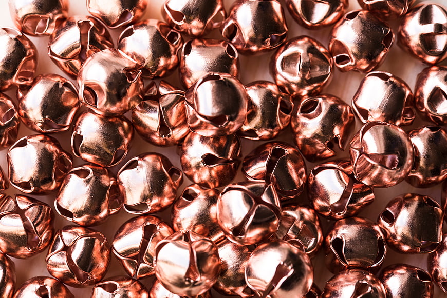 Close-up of shiny copper jingle bells texture background