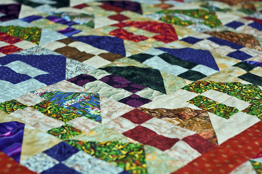 Close-up of colorful patchwork quilt with geometric patterns