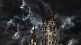 Dramatic lightning striking church tower in storm