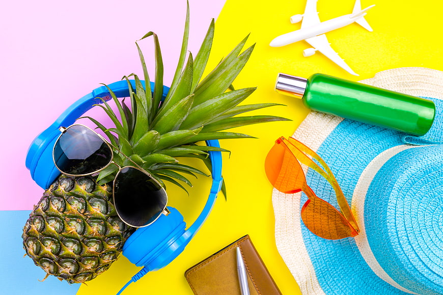 Colorful Summer Travel Flat Lay with Pineapple and Accessories