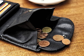 Open Black Leather Wallet With Euro Coins On Wooden Table