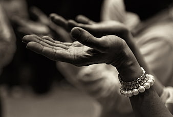 Close-up of Hands with Bracelets in Black and White
