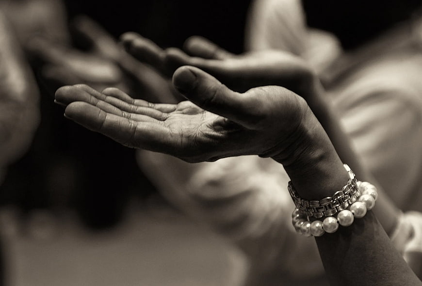 Close-up of Hands with Bracelets in Black and White