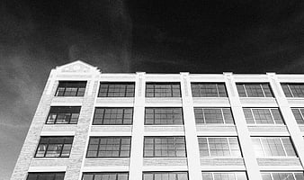 Black and white low angle view of modern office building facade