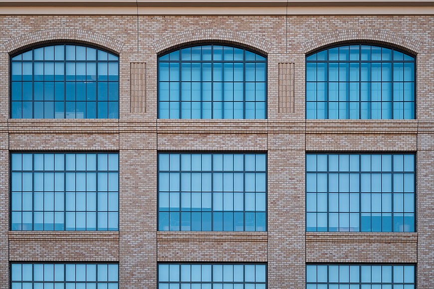 Modern Brick Building Facade with Blue Windows