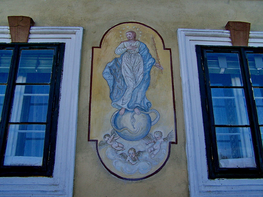 Religious mural of Virgin Mary between windows