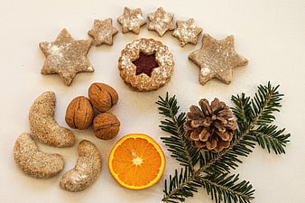 Christmas Star Cookies, Walnuts, Orange, and Pinecone Flat Lay