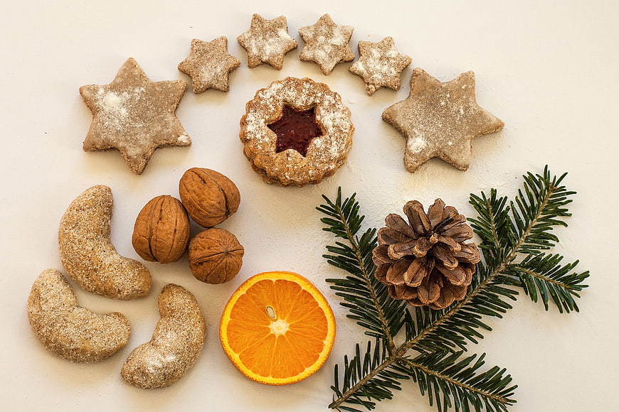 Christmas Star Cookies, Walnuts, Orange, and Pinecone Flat Lay