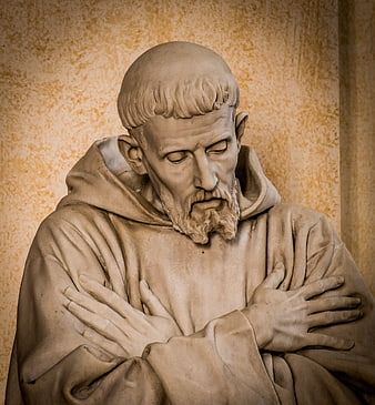 Close-up of Saint Francis of Assisi statue in prayer