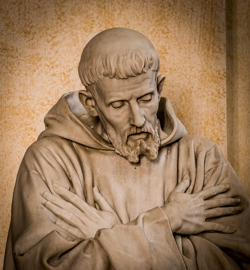 Close-up of Saint Francis of Assisi statue in prayer