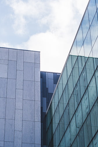Modern Glass and Concrete Architecture with Sky Reflection