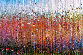 Abstract multicolored water droplets on glass texture background