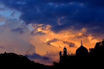 Silhouette of Gampola Vihara Temple Against Dramatic Orange Sunset Sky