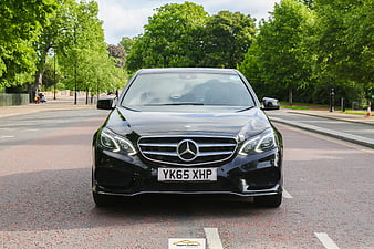 Front view of black Mercedes S-Class luxury car on street