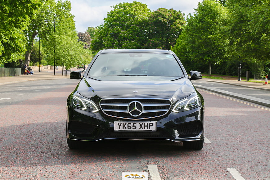 Front view of black Mercedes S-Class luxury car on street