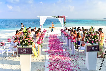 Tropical Beach Wedding Ceremony Setup With Floral Aisle And Ocean View