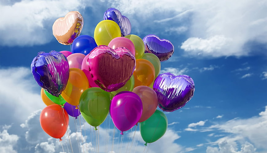 Colorful Heart Balloons Floating in Blue Sky